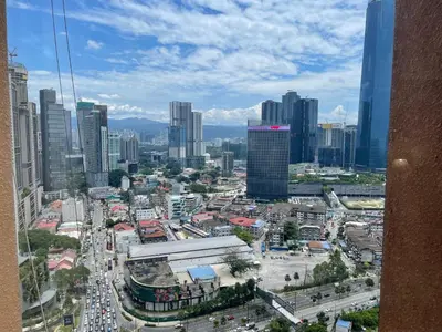 a view of a city with a lot of traffic at KL Elegant Apartment at Times Square in Kuala Lumpur