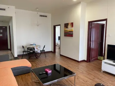 a living room with a couch and a table at KL Elegant Apartment at Times Square in Kuala Lumpur