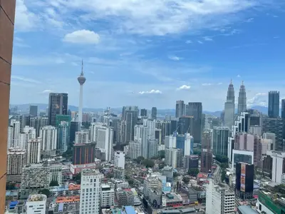 a view of a large city with tall buildings at KL Elegant Apartment at Times Square in Kuala Lumpur