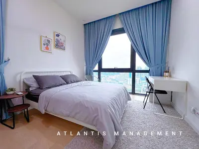 a bedroom with a bed and a desk and a window at KL Eco City Luxury 2 Bedrooms Apartment, Walking Distance to Mid Valley & The Garden & LRT in Kuala Lumpur