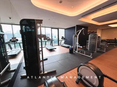 a gym with treadmills and machines in a building at KL Eco City Luxury 2 Bedrooms Apartment, Walking Distance to Mid Valley & The Garden & LRT in Kuala Lumpur