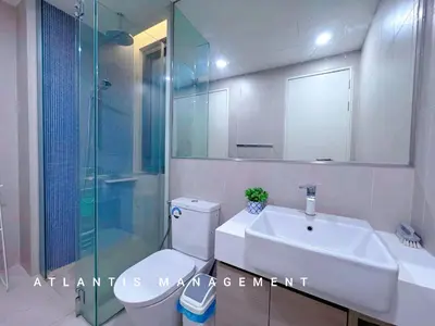 a bathroom with a toilet and a sink and a shower at KL Eco City Luxury 2 Bedrooms Apartment, Walking Distance to Mid Valley & The Garden & LRT in Kuala Lumpur