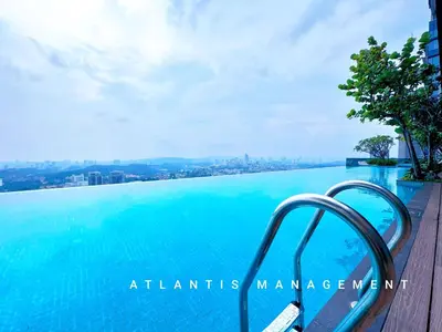 a swimming pool with a view of the city at KL Eco City Luxury 2 Bedrooms Apartment, Walking Distance to Mid Valley & The Garden & LRT in Kuala Lumpur
