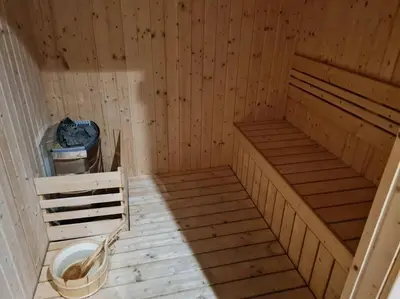 a sauna with two beds and a toilet in it at Muji Tiny Studio Near KLCC in Kuala Lumpur