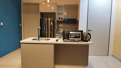 a kitchen with a sink and a microwave on a counter at KLCC view 1BR service suite with Balcony Trion B5311 KL in Kuala Lumpur