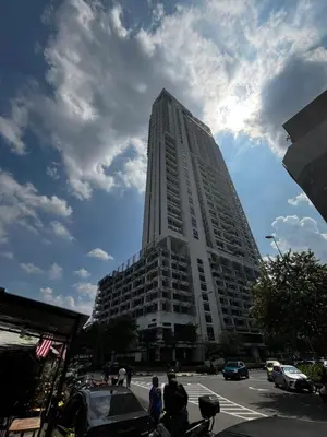 a tall building with people standing in front of it at THE COLONY INFINITUM Sweet Home SR in Kuala Lumpur