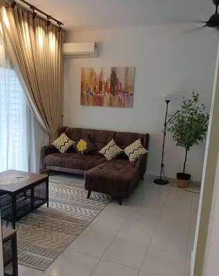 a living room with a couch and a table at The suits klcc in Kuala Lumpur