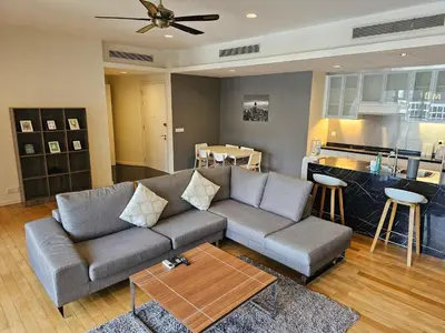 a living room with a couch and a kitchen at Resort Style Haven 3BR6pax St Mary KLCC Twin Towers View in Kuala Lumpur