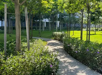 a path in a park with flowers and trees at MVD41#Family Suite 8pax 3 Rooms M Vertica Velocity Mall Cheras IKEA Mytown Short Walk to MRT & LRT Maluri in Kuala Lumpur