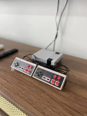 two remote controls sitting on top of a wooden table at PavKlccTrxVelo ,MrtLrt ,13PAX ,4R2B ,Free KLCCPavTRXVelocity X MrtLrt X 13PAX X 4R2B X Free 4CPark in Kuala Lumpur