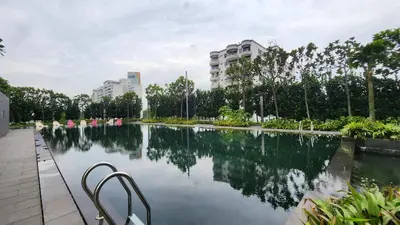 a large pool of water in a city with buildings at Opus Residences Kuala Lumpur by Infini Suites in Kuala Lumpur