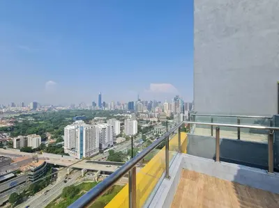 a view of a city from the balcony of a building at Neu Suites Near Gleneagles 10 minutes to KLCC in Kuala Lumpur