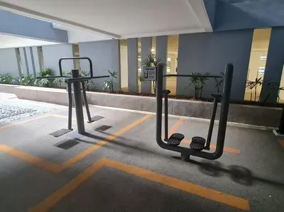 a bike rack in a parking lot in a building at Neu Suites Near Gleneagles 10 minutes to KLCC in Kuala Lumpur
