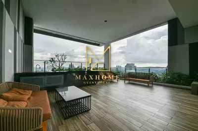 a large living room with a view of the city at Maxhome Cozy at The Luxe in Kuala Lumpur