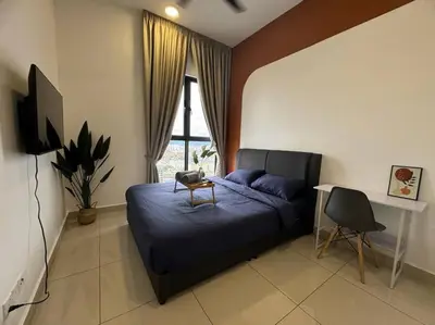 a bedroom with a bed and a desk and a window at TRION KL, KLCC TRX IKEA at Chan Sow Lin, Kuala Lumpur by ONE Guesthouse in Kuala Lumpur