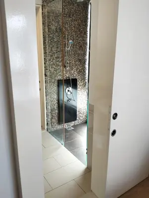 a bathroom with a shower with a glass door at Star Suites At Swiss Garden Residences in Kuala Lumpur