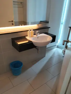 a bathroom with a sink and a mirror at Star Suites At Swiss Garden Residences in Kuala Lumpur