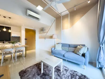 a living room with a blue couch and a table at 5 pax - Bangsar South - 7 mins drive to Mid Valley in Kuala Lumpur