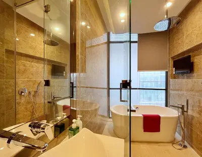 a bathroom with a shower and a tub and a sink at Super suite at Dorsett residence bukit bintang kl in Kuala Lumpur