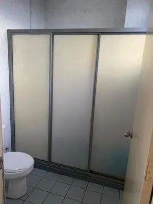 a bathroom with a toilet and a shower stall at Cityscape KL in Kuala Lumpur