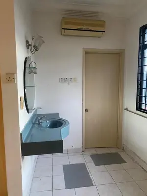 a bathroom with a blue sink and a mirror at Cityscape KL in Kuala Lumpur