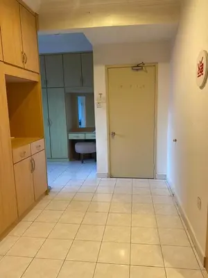 an empty kitchen with a door in a room at Cityscape KL in Kuala Lumpur