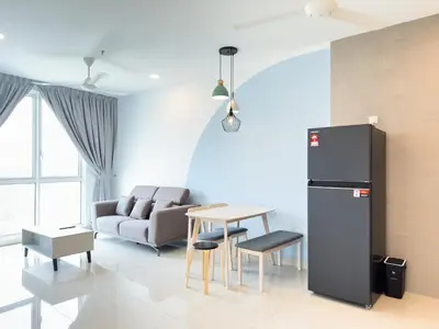 a living room with a couch and a table at 2B2B Cozy - 5 min to PWTC - Sentul KL in Kuala Lumpur