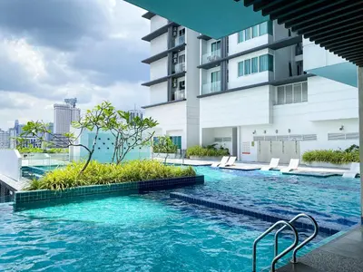 a swimming pool in the middle of a building at 2B2B Cozy - 5 min to PWTC - Sentul KL in Kuala Lumpur