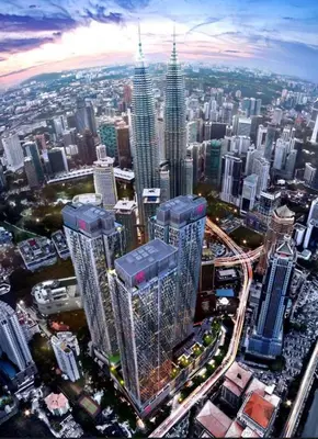 an aerial view of a large city with tall skyscrapers at Star KLCC by homestay in Kuala Lumpur