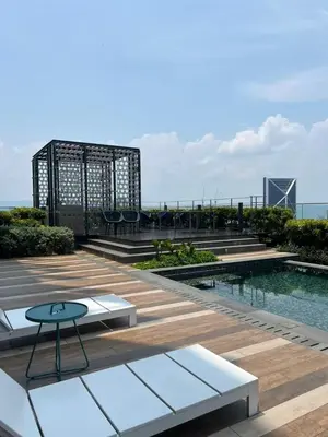 a patio with a table and a pool on a building at Star KLCC by homestay in Kuala Lumpur