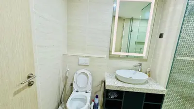 a bathroom with a toilet and a sink at Star KLCC by homestay in Kuala Lumpur