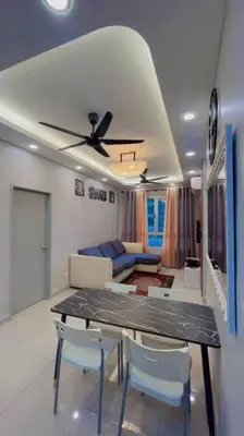 a living room with a dining table and a ceiling fan at Setapak KL Apt 3 Room 8 pax in Kuala Lumpur