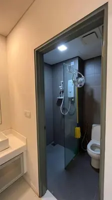 a bathroom with a shower and a toilet at KL City Centre in Kuala Lumpur