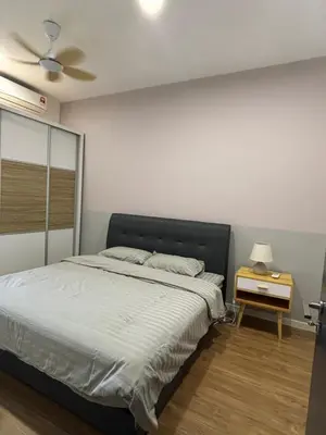 a bedroom with a large bed and a night stand at Modern Luxury Apartment, Sunway, TRX in Kuala Lumpur