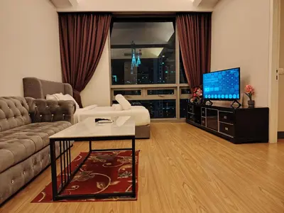 a living room with a couch and a tv at Swiss Garden Residence by Offex Suites KL in Kuala Lumpur