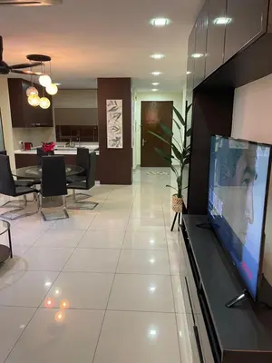 a living room with a large flat screen tv at cozy 3 bedroom 6PAX setapak central mall in Kuala Lumpur