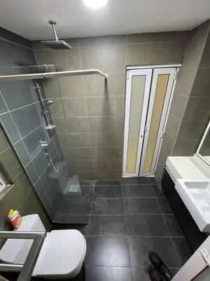a bathroom with a shower and a toilet and a sink at cozy 3 bedroom 6PAX setapak central mall in Kuala Lumpur