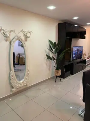 a mirror on a wall in a waiting room at cozy 3 bedroom 6PAX setapak central mall in Kuala Lumpur