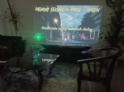 a piano and a chair in a room with a poster at Phenomenal atmosphere 4 PAX setapak central mall in Kuala Lumpur