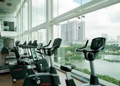 a row of cardio machines in a gym with a large window at Phenomenal atmosphere 4 PAX setapak central mall in Kuala Lumpur