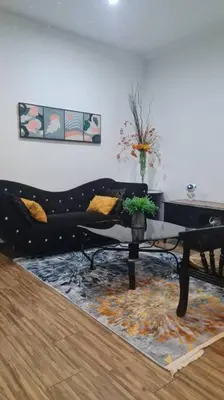 a living room with a couch and a table at Phenomenal atmosphere 4 PAX setapak central mall in Kuala Lumpur