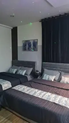a bedroom with two beds and a window at Phenomenal atmosphere 4 PAX setapak central mall in Kuala Lumpur