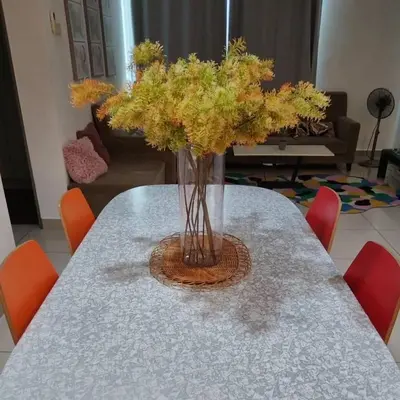 a vase of flowers sitting on a table at Cozy lake view at top of setapak central mall in Kuala Lumpur
