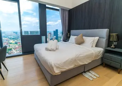 a bedroom with a large bed with a large window at STAR RESIDENCE KLCC By GANTYA in Kuala Lumpur