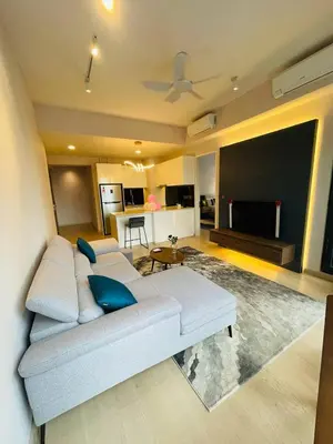 a living room with a couch and a flat screen tv at STAR RESIDENCE KLCC By GANTYA in Kuala Lumpur