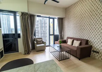 a living room with a couch and a table at STAR RESIDENCE KLCC By GANTYA in Kuala Lumpur