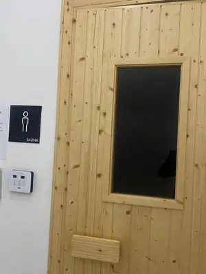 a window in a wooden wall with a sign at RSJ Homestay at Setapak - Studio in Kuala Lumpur