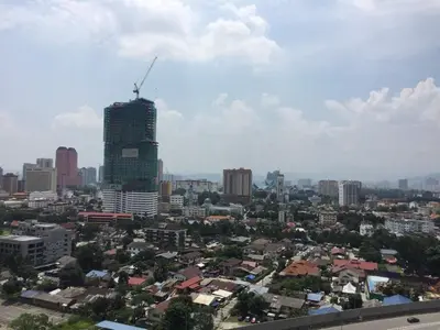 a view of a city with a tall building at Bmchomes Mercu summer suite in Kuala Lumpur