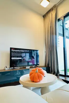 a stuffed animal sitting on a table in a living room at V Residence Suites-3A in Kuala Lumpur