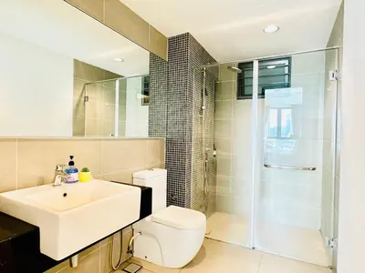 a bathroom with a toilet and a sink and a shower at V Residence Suites-3A in Kuala Lumpur